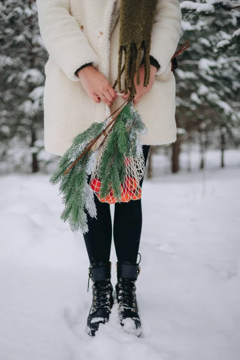 oversized coat with a wool scarf and chunky boots.