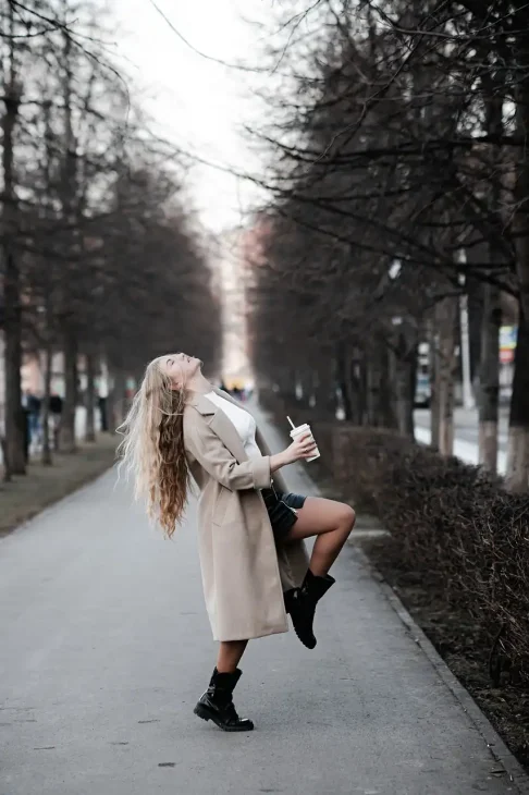 oversized coat with a wool scarf and chunky boots.